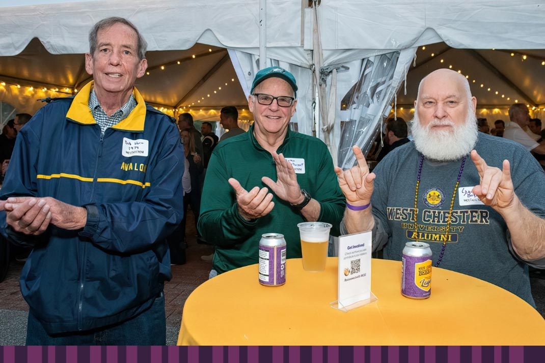 3 men in wcu fan gear enjoying refreshments
