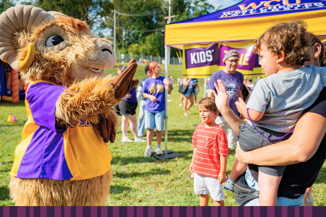 Rammy giving 'high fives' to kid