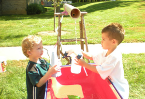 2 boys playing with water
