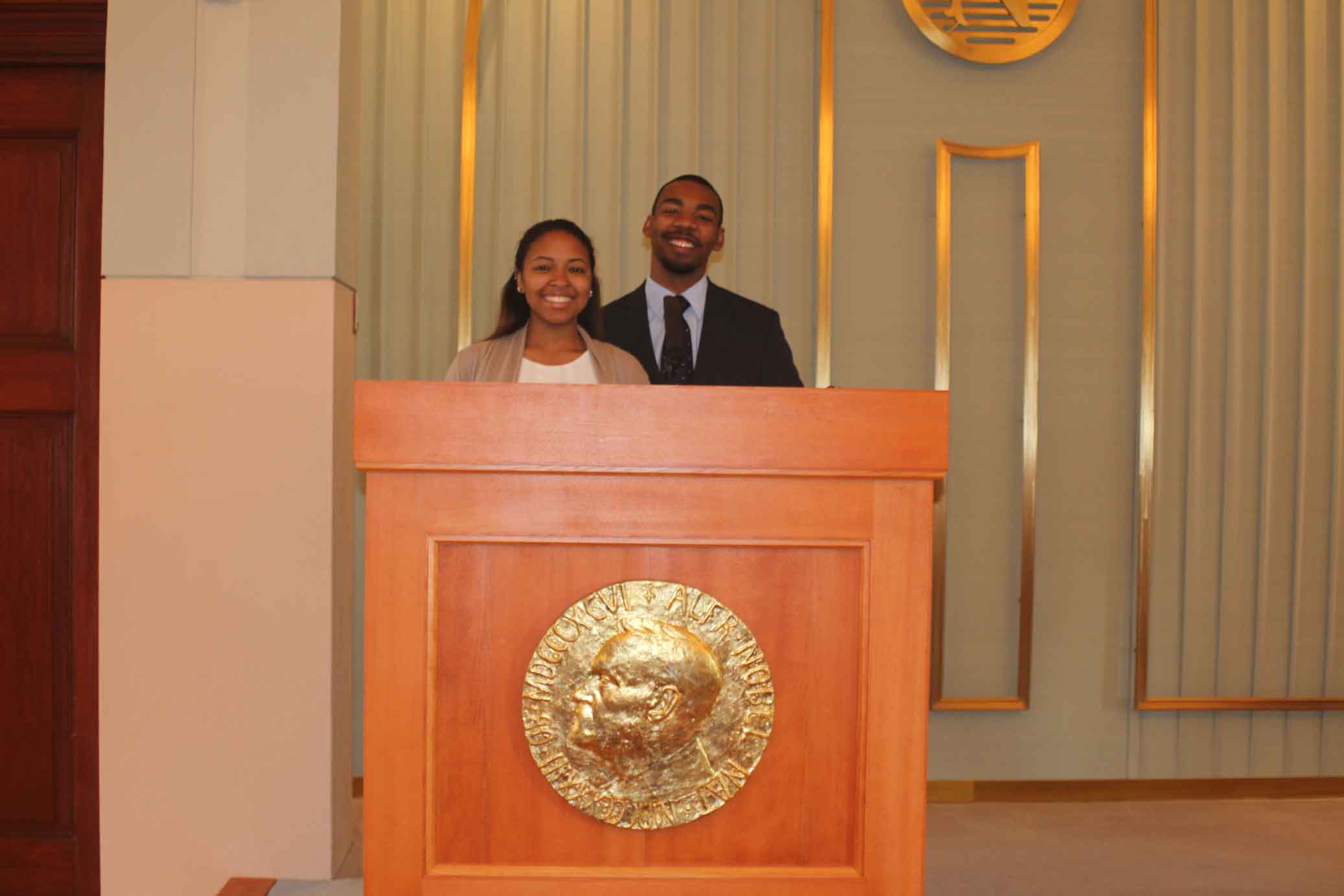 Two people at a podium