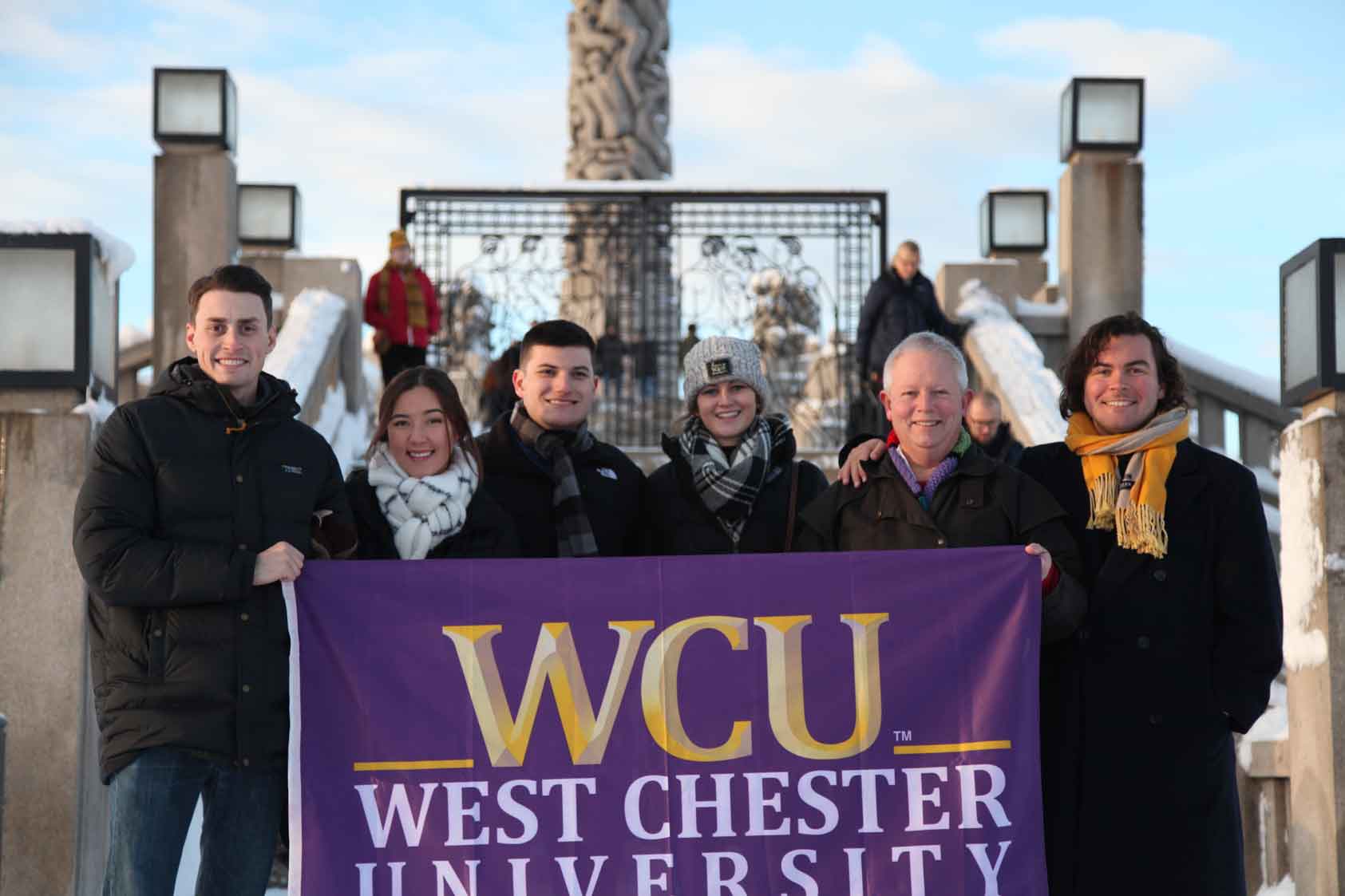 Group posing with WCU flag