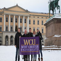 Group posing with WCU flag