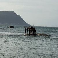 Group posing the ocean