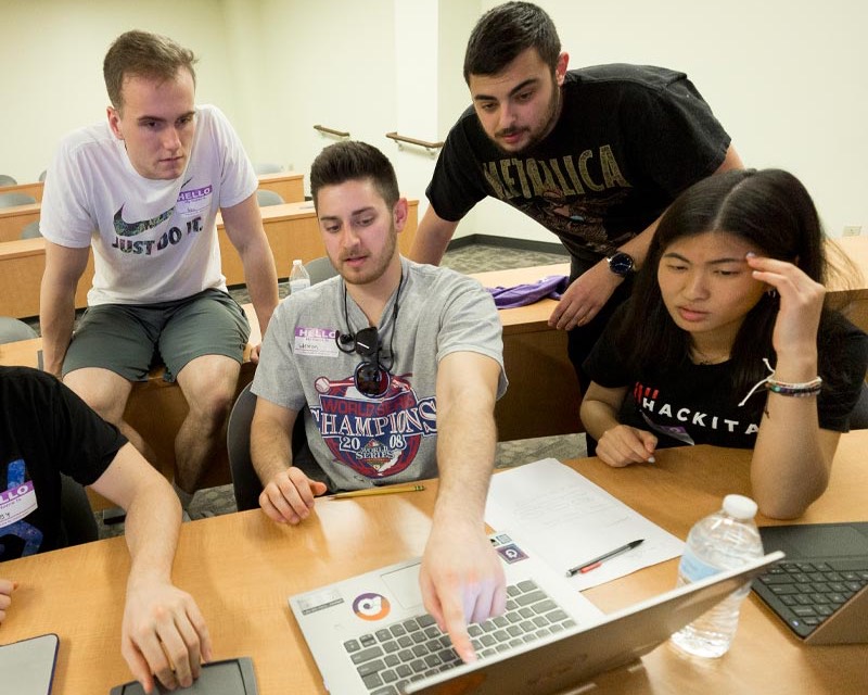 Computer Science students participating in Coding competition