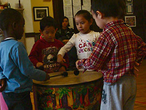 Children learning to play the drums