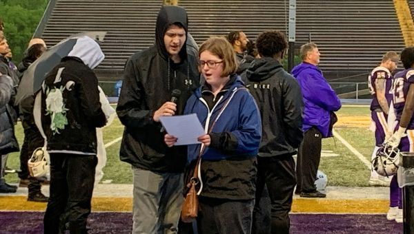 WCU D-CAP students (pictured l to r) Emma Billingsley and Brendan Keller sang “The Star-Spangled Banner” to officially open the University’s traditional Spring Football Scrimmage.