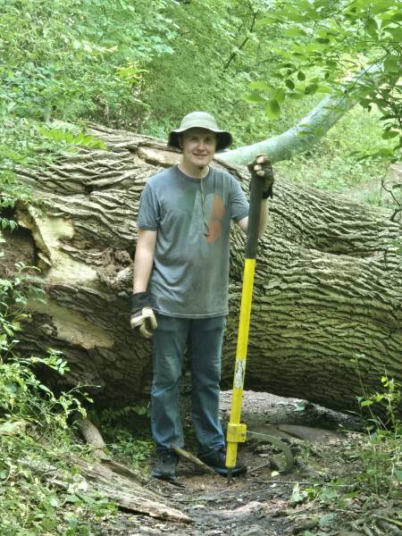 GNA Student Intern Jack Ridenour next to a large, fallen Tulip Tree GNA Student Intern Jack Ridenour next to a large, fallen Tulip Tree