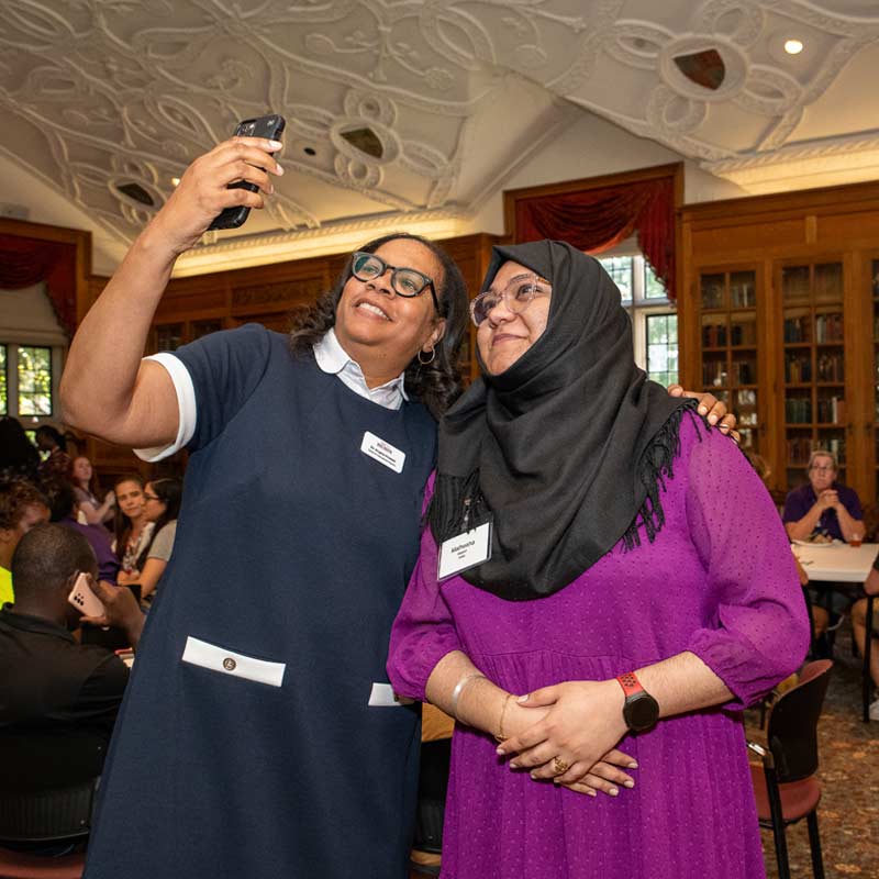 2 women at a conference taking a selfie