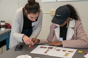 two people working on a worksheet